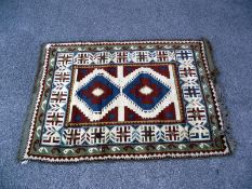 A multi coloured Aztec/Block pattern rug. Length 190cm x 130cm. COLLECT ONLY.