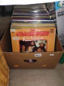 A box of LP records including The Beach Boys etc.