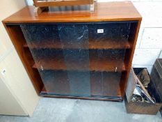 A 1950's teak glazed bookcase. 82cm x 38cm x height 93cm. COLLECT ONLY.