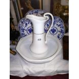 A Victorian/Edwardian white pottery wash basin and jug. COLLECT ONLY.