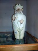 A tall ornate vase with relief flower decoration, height 45cm, COLLECT ONLY.