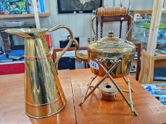 A brass kettle on stand and jug