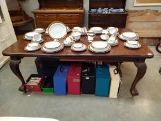 A Victorian Mahogany extending dining table on ball and claw feet. 104 cm x 126-180 cm x height