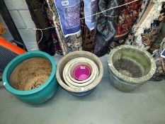 Four graduated blue planters, large green planter and concrete planter. COLLECT ONLY.