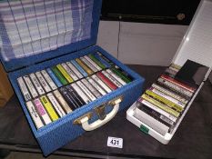 A Brexton case of cassette tapes and one other.