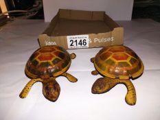 A pair of early 20th century tin plate clockwork tortoises, no markings, possibly Gunnthermann