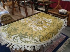 A Vintage green/ white round rug. Diameter approximately 140cm. COLLECT ONLY.