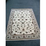 A large beige patterned/ Persian rug. Length 2.28cm x 1.60cm. COLLECT ONLY.