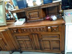 A 1950's oak buffet cupboard. 124cm x 48cm x 123cm. COLLECT ONLY.