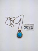 A Mexican turquoise set pendant in silver, stamped