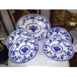 Four Minton's blue and white dinner plates and a meat platter