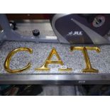 Three large gilded wooden sign letters, ACT. COLLECT ONLY.