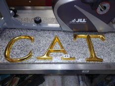 Three large gilded wooden sign letters, ACT. COLLECT ONLY.