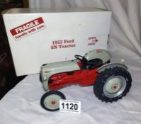 A Danbury mint Ford 8N tractor with box. No certificate.