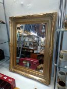 An antique gilt framed bevel edged mirror (chip to frame) 74cm x 94cm, COLLECT ONLY.