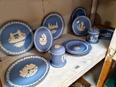 A good selection of Wedgewood blue jasper ware including plates and lidded pots.