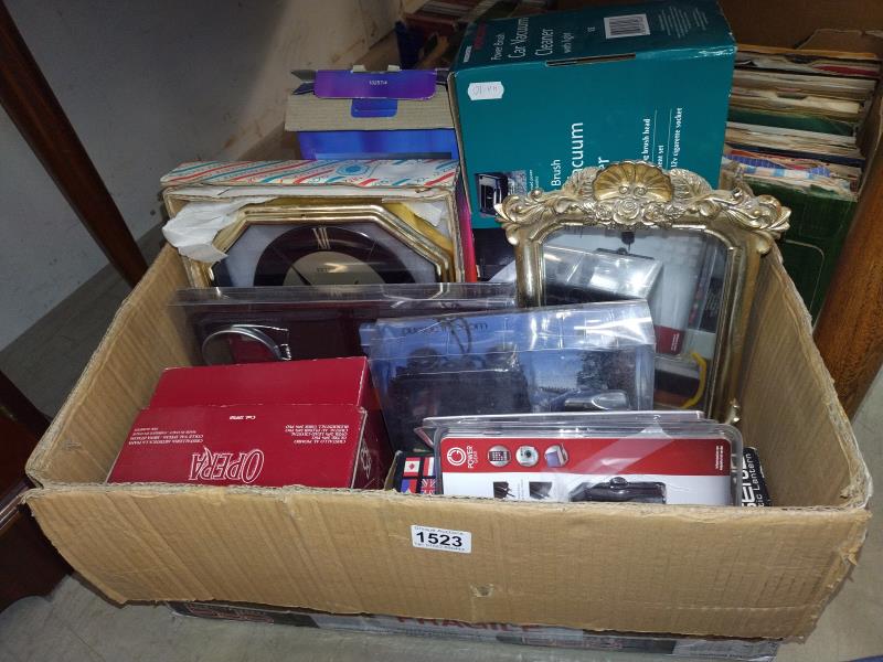 A box of household goods including clock, mirror small vacuum cleaner etc,