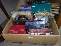 A box of household goods including clock, mirror small vacuum cleaner etc,
