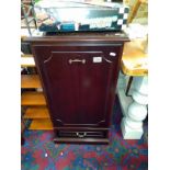 A dark wood stained single door cabinet with shelves and bottom drawer. (47cm x 49cm x height