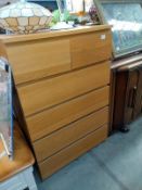 A pine effect bedroom chest of drawers. 81cm x 49cm x height 123cm. COLLECT ONLY.