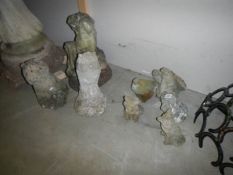 Eight small garden ornaments (eagle, dog, pigeon, foxes etc.,) COLLECT ONLY.
