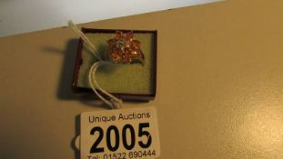 A yellow gold natural yellow sapphire and diamond ring, size R, 5 grams.