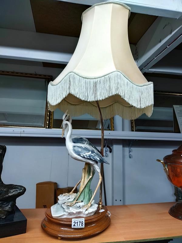 A table lamp featuring a pair of Herons. Signed R. Pennati Height approximately 79cm