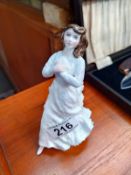 A Royal Doulton figurine. Name obscured by makers label