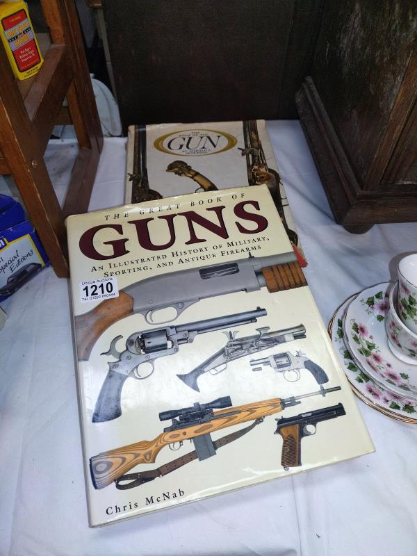 Two old large hardback reference books on guns.