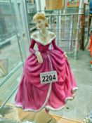 A Royal Doulton figure 'Belle' HN4235