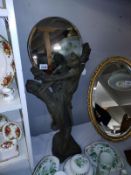 An art nouveau style figure with mirror. COLLECT ONLY.