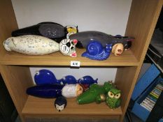 Two shelves of ceramic garden ornaments. COLLECT ONLY.