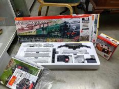 A boxed Hornby Flying Scotsman 00 train set and a boxed Hornby goods shed. COLLECT ONLY