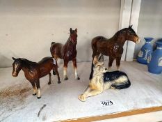 A Beswick horse and one marked Made in England , one Japan and a Sylvac Alsatian dog.