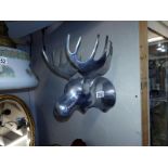 A polished aluminium stag head wall ornament. Hat/coat rack. 27cm x 33cm x 25cm