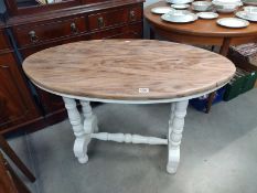 An antique style oval side table on turned legs (108cm x 59cm x 72cm high)