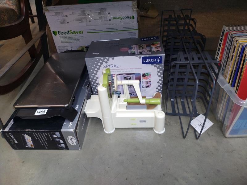 A quantity of kitchen items including food saver with spare bags, hot plate, noodle maker etc.