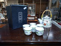 A boxed Chinese tea set