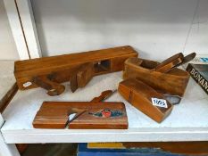 Four vintage wooden carpenters planes.