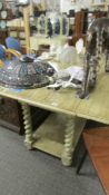 A weathered effect drop leaf dining table, 168 x 48 cm closed, 116 cm open, 78 cm high,