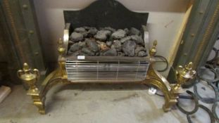 A coal effect electric fire with brass surround. COLLECT ONLY.