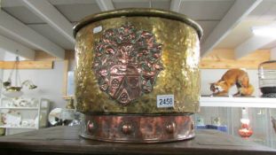 A 19th century brass and copper log bucket/coal scuttle with armorial crest, COLLECT ONLY.