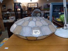 A vintage leaded and celluloid/ plastic flying saucer shape lamp shade. D 39cm x 19cm.