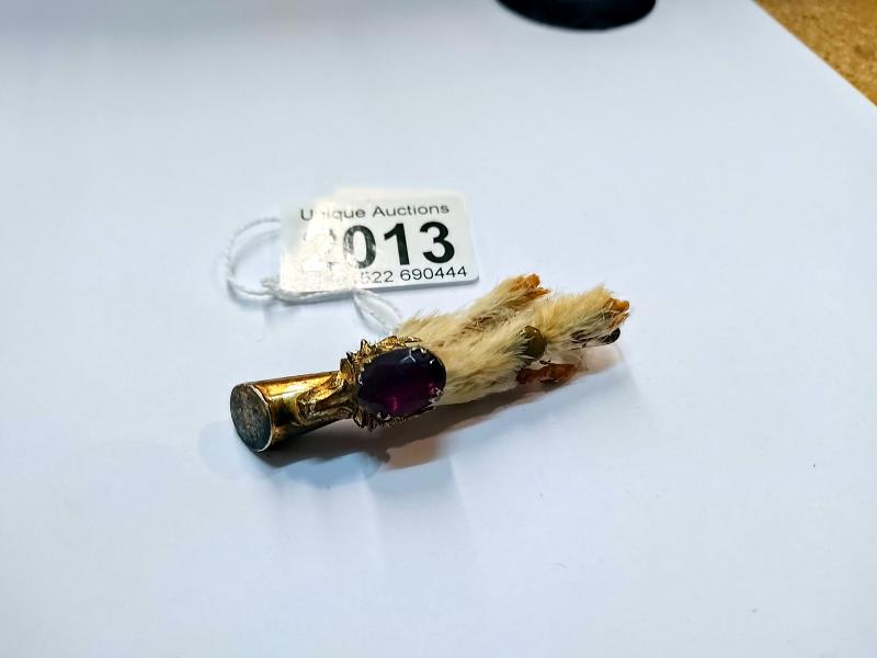 A Lady's traditional style kilt pin made from a grouse's foot.