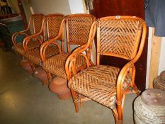 A set of four bamboo conservatory chairs, COLLECT ONLY.