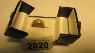An 18ct gold three stone diamond ring, size S, 5.8 grams.