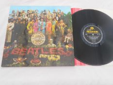 The Beatles - Sgt Peppers UK LP Record 1st press PMC 7027 XEX 637-1 XEX 638- 1 N/M The vinyl is in