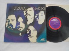 Liquid Smoke ? Liquid Smoke. UK 1st press Record LP 6466003 1Y-1 and 2Y-1 EX The vinyl is in