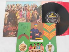 The Beatles Sgt Peppers UK 1st press LP record PMC 7027 XEX 637-1 and XEX 638-1 EX The vinyl is in
