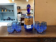 A blue glass decanter and 6 glasses with gold leaf decoration COLLECT ONLY